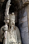 Bangkok Wat Arun - Details of the statues of Chinese saints of the pagoda at the corners of the Ubosot coutyard. 